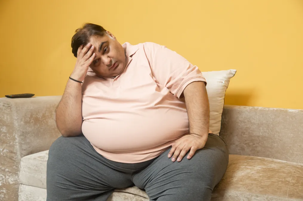 Person experiencing sleep apnea symptoms